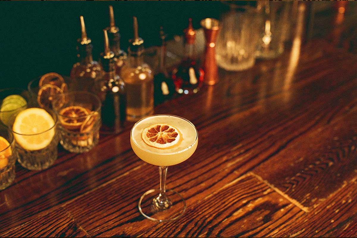 cocktail with dried lemon slice