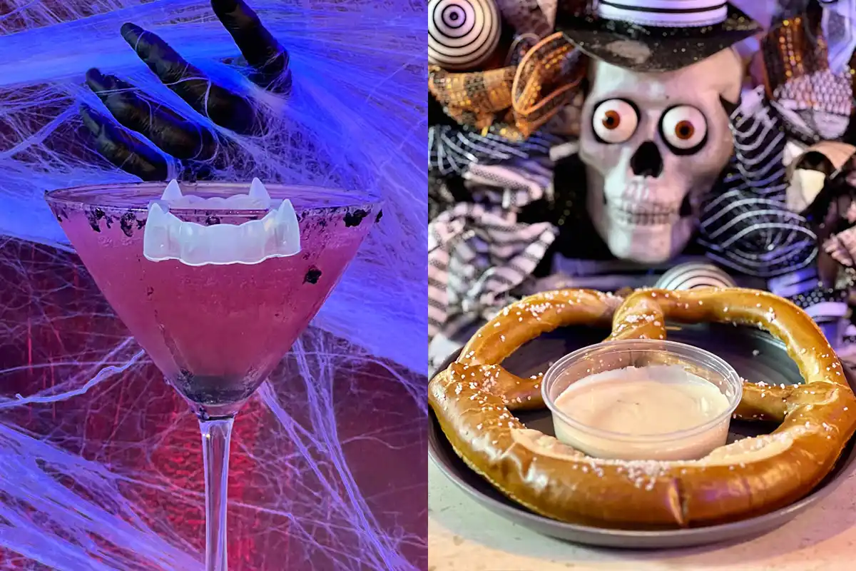 cocktail with vampire teeth and pretzel with cheese in front of a skull