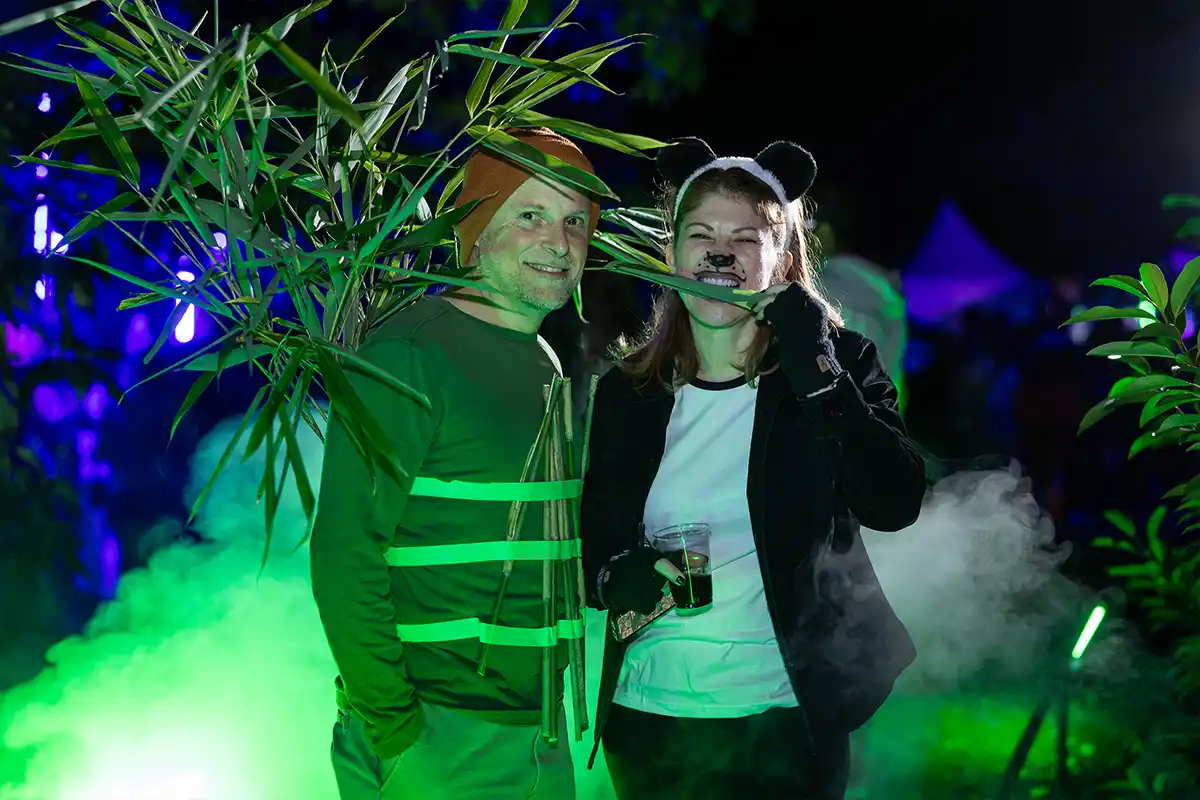 couple wearing panda and bamboo costumes