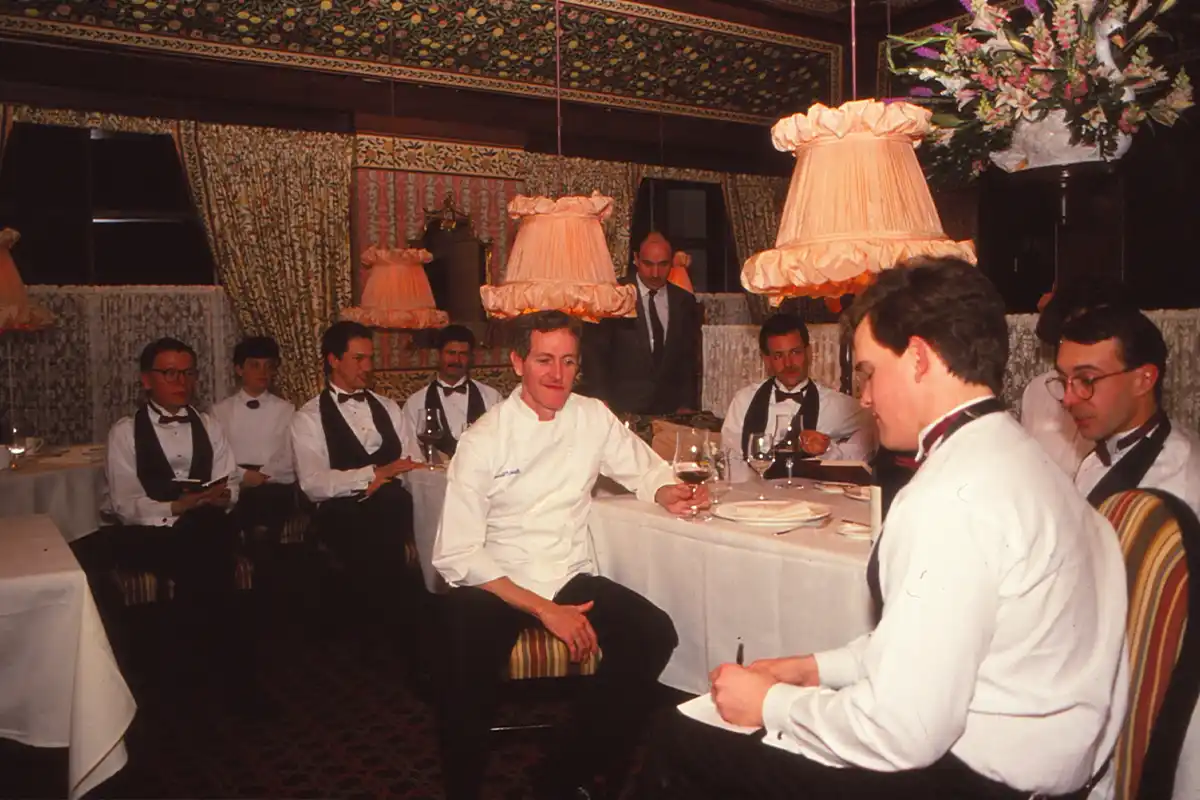 O'Connell, center, surrounded by staff in the dining room in the 1980s.