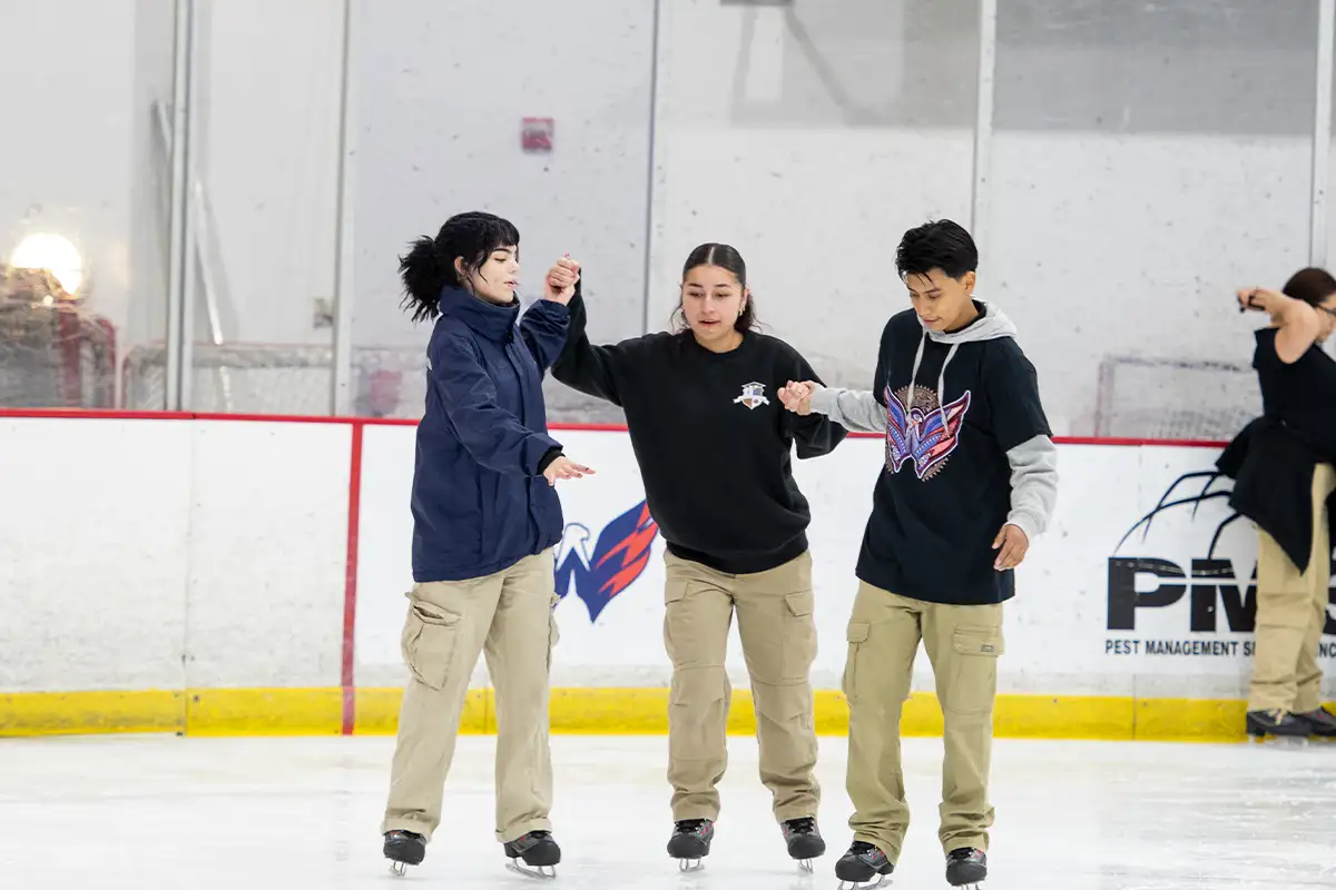 Students learn to skate at a Rink Pass event hosted by the Washington Capitals.