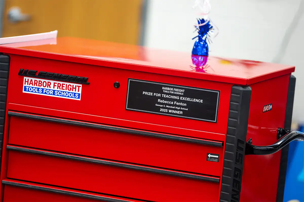 Rebecca Fenton was awarded a toolbox with a plaque of her award