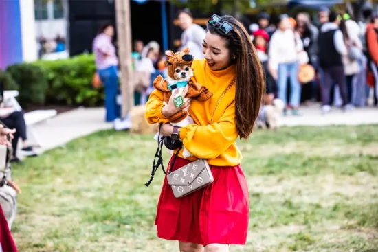 A pet owner and dog dressed up for Halloween at the Boro at Tysonos