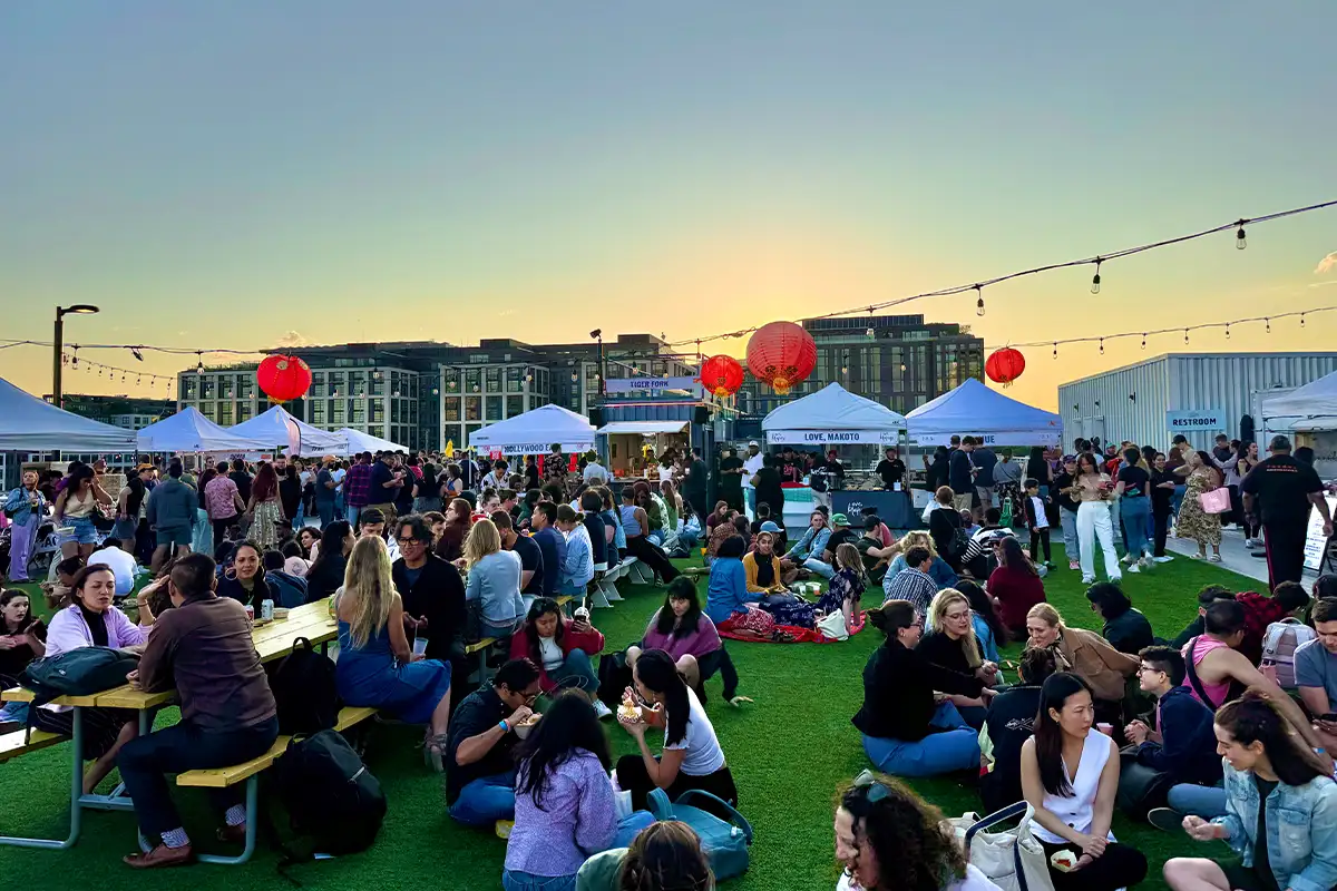 Guests eat and shop at Mid-Autumn Night Market. 