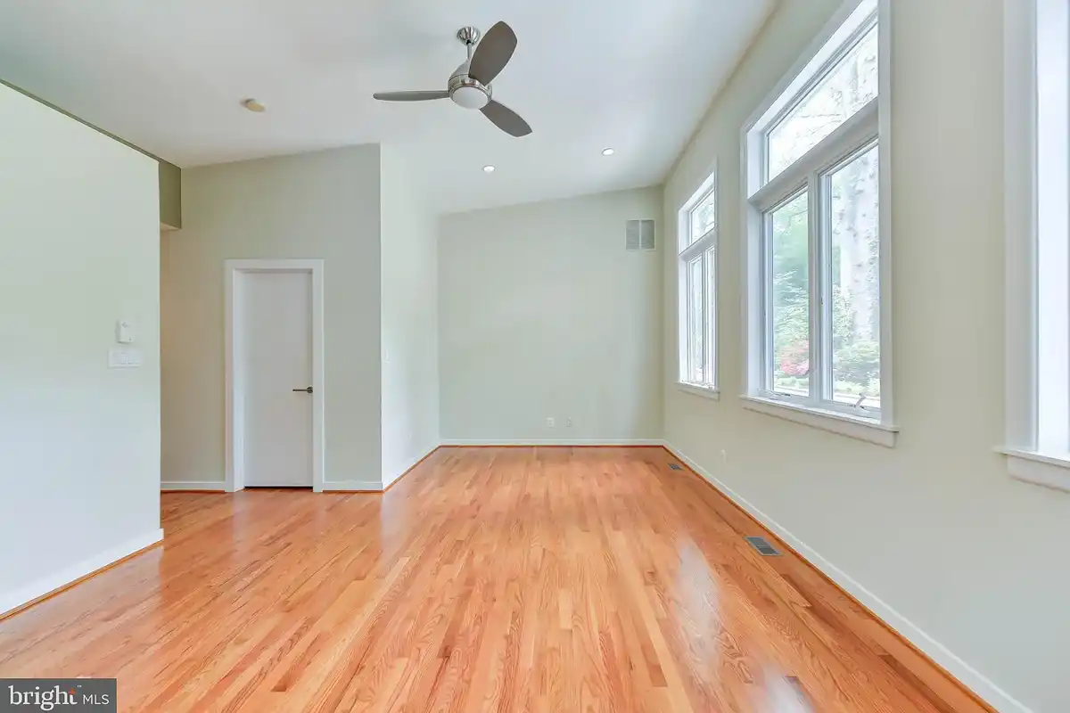 primary bedroom with hardwood floors