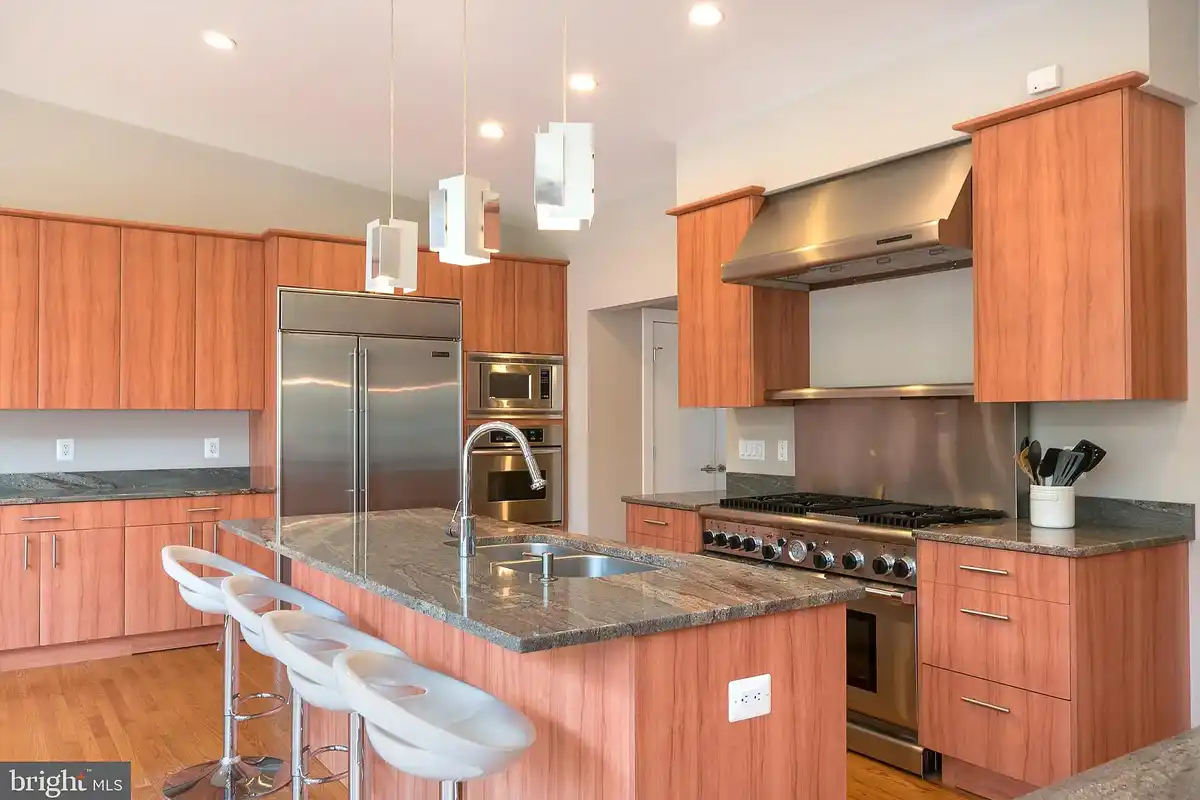 gourmet kitchen with custom maple wood cabinets
