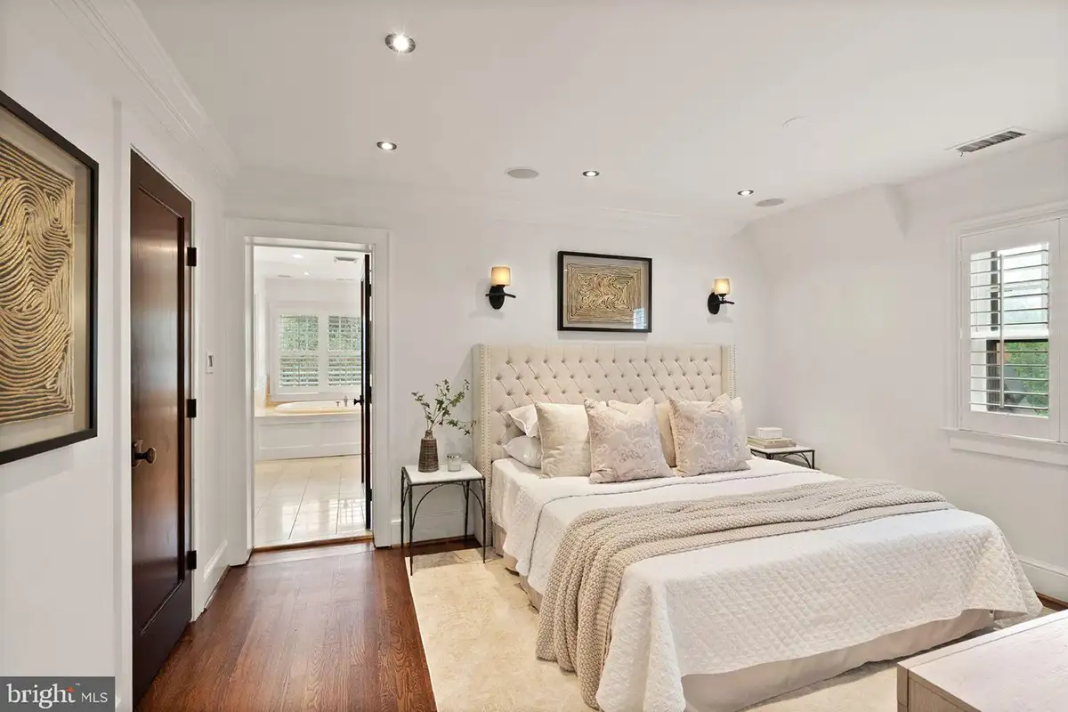 The primary bedroom with an en-suite bathroom at 1520 N Highland St. 