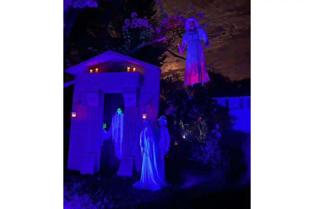 floating ghost next to mausoleum