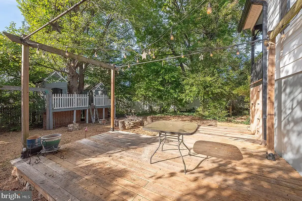 The backyard with dual treehouses and a large deck at 222 Locust St.