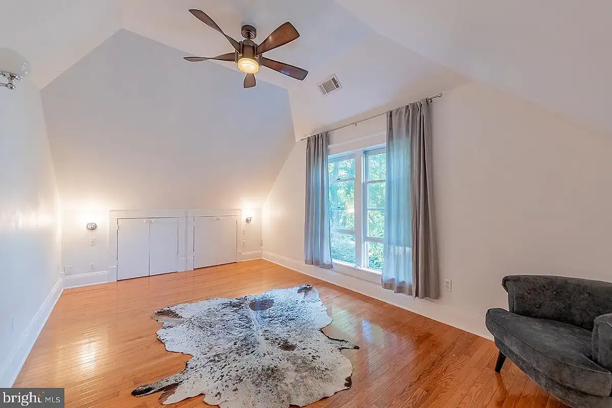 The primary bedroom with high ceilings and built-in cabinets at 222 Locust St.