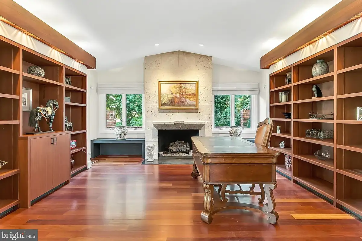 The library and office with a limestone fireplace at 1753 Army Navy Dr.