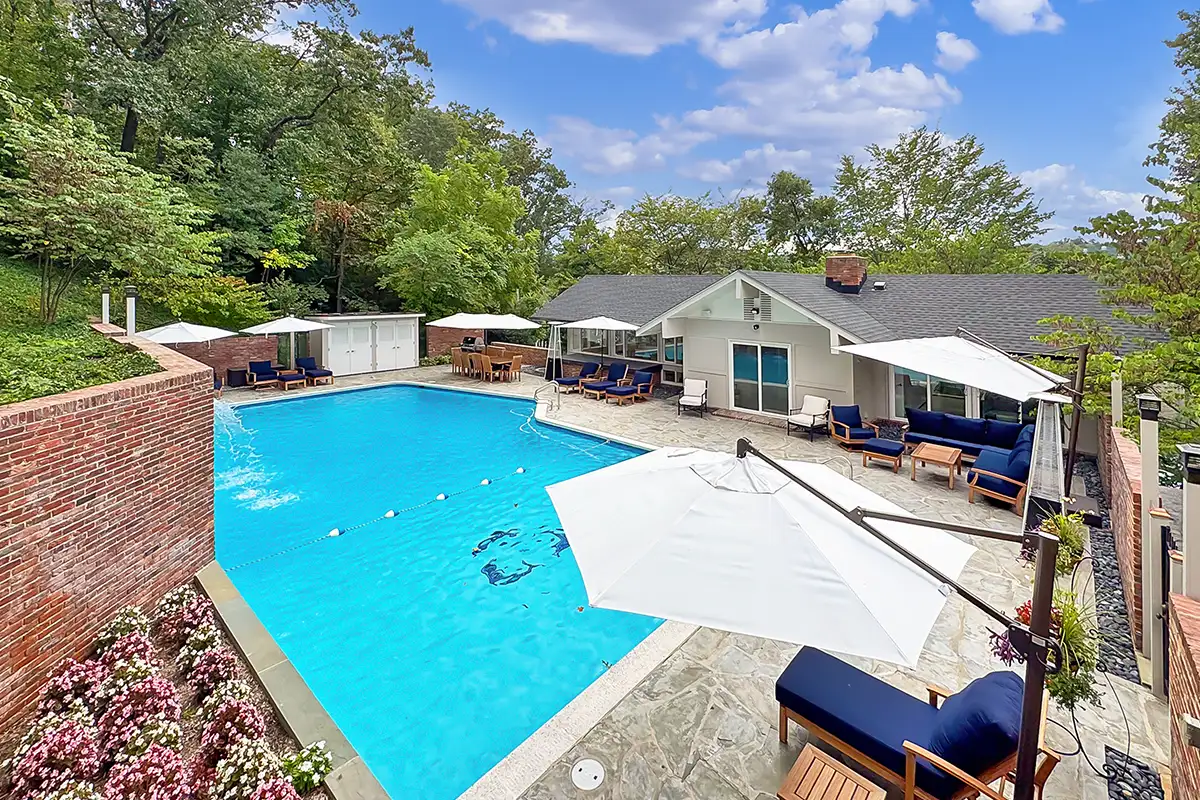 The pool and exterior of the guest house at 1753 Army Navy Dr.