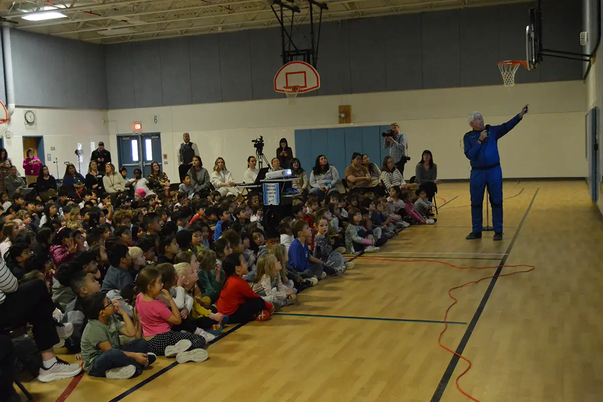 Blue Origin astronaut George C. Nield gives a presentation at North Springfield Elementary School.