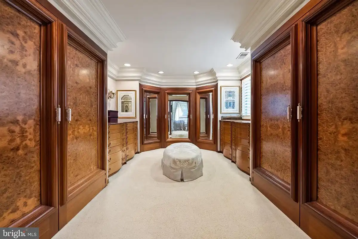 walk-in closet with custom cabinets