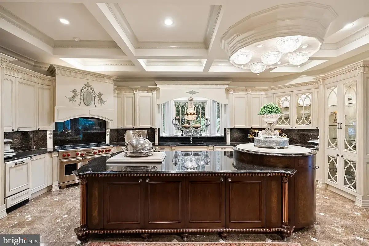 kitchen with coffered ceiling and glass-front cabinets