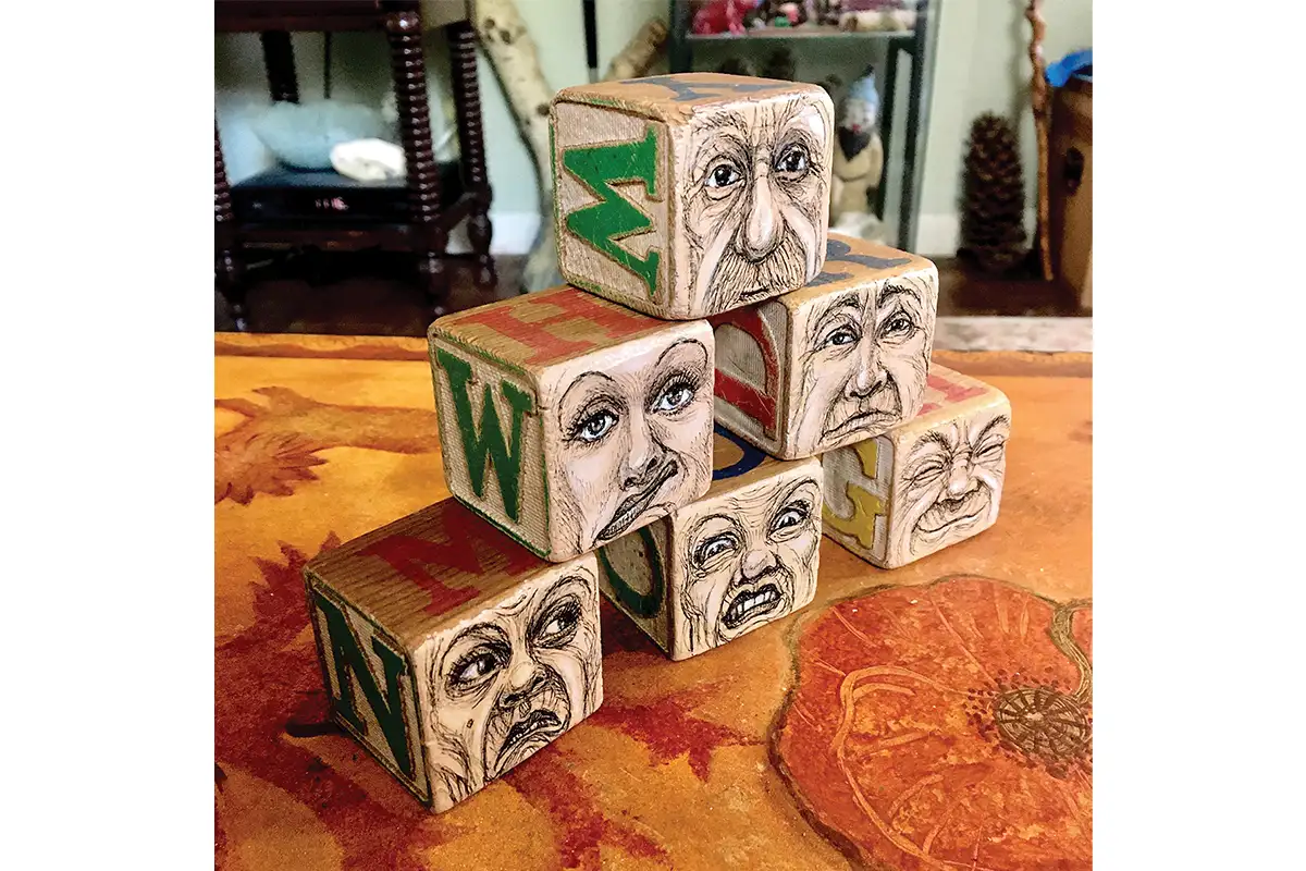 wooden blocks illustrated with faces