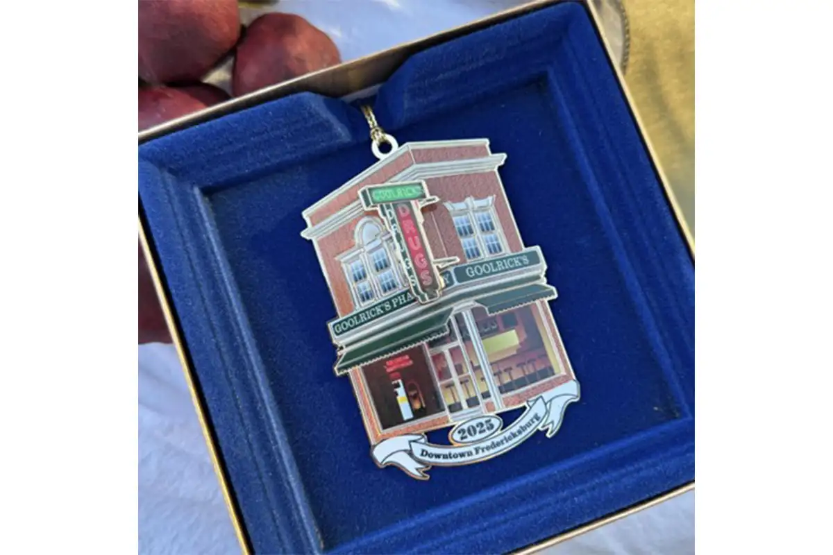 The first commemorative Fredericksburg Main Street ornament honors Goolrick’s Pharmacy. The ornament is displayed in a blue box.