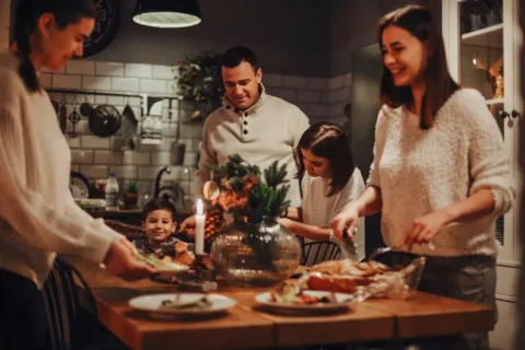 Family cooking holiday meal with kids