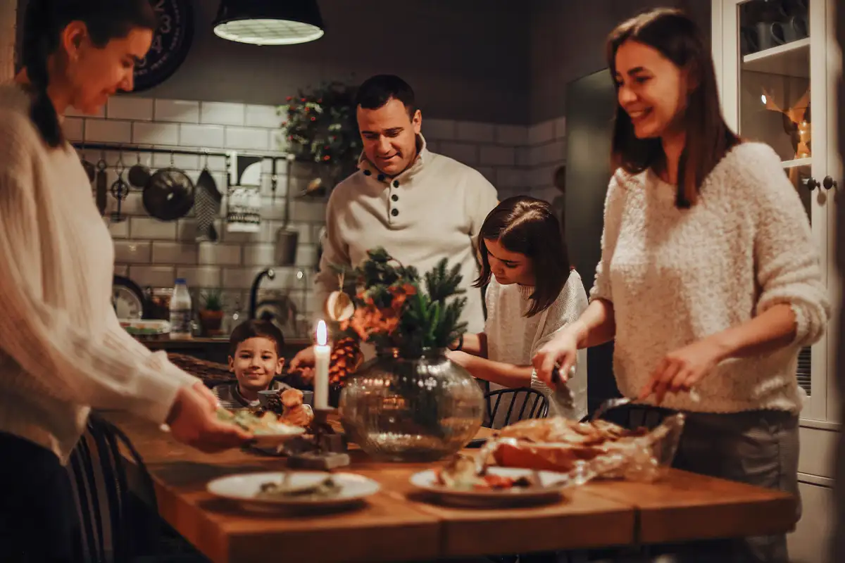 Family cooking holiday meal with kids