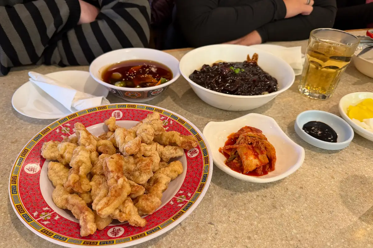 a table with Korean food served on the Virginialicious food tour