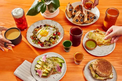 breakfast food and drinks on a table at Life Alive Organic Cafe