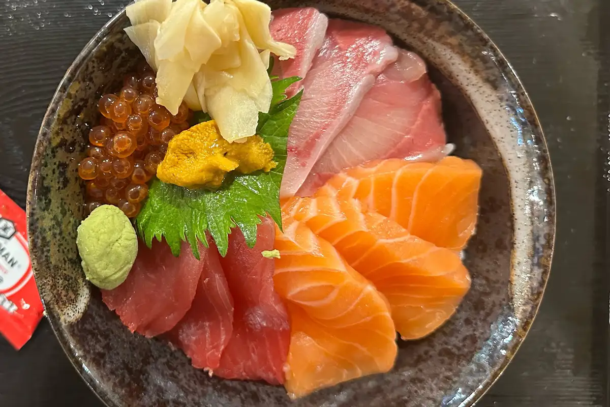 a bowl of sliced fish and roe at Marufuji Japanese Market 