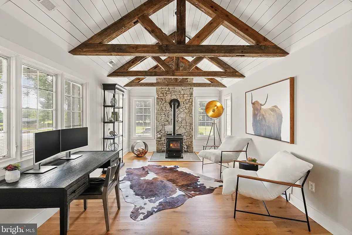 Study with fireplace, peaked ceilings