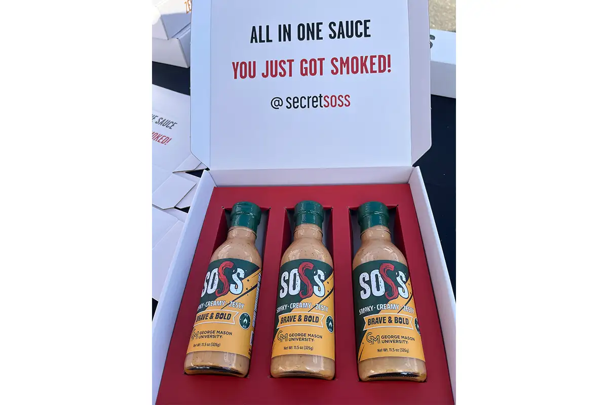 a box with three flavors of SOSS hot sauce
