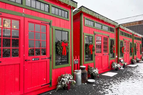 red winter-themed cabins at proof kitchen