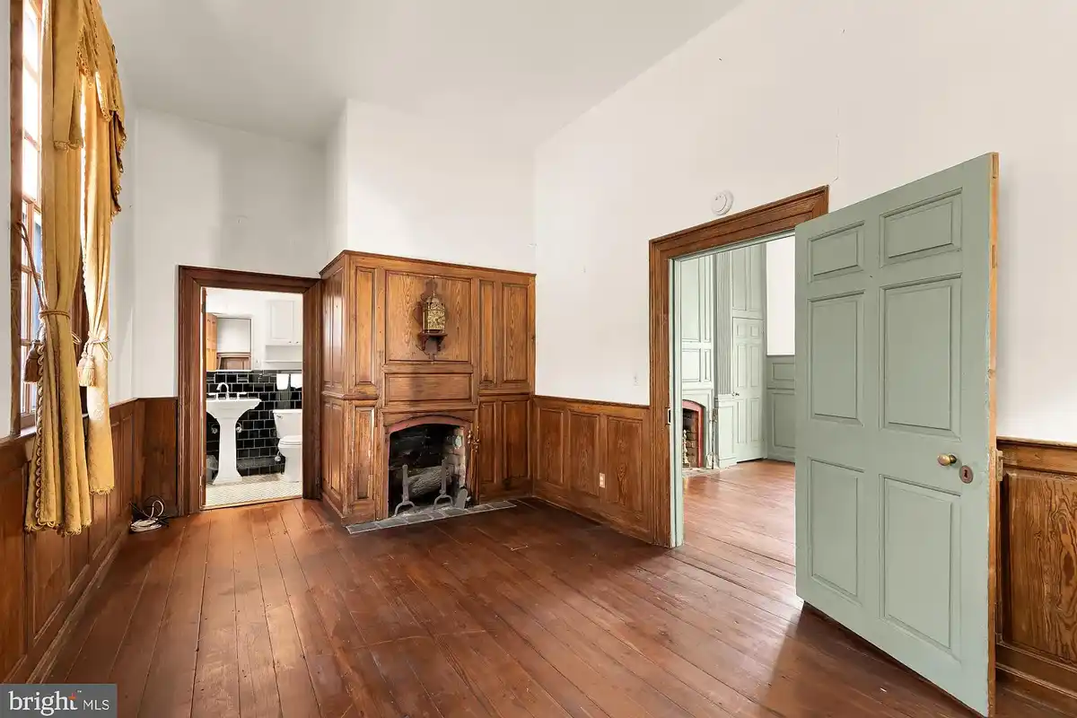 den with wood-burning fireplace