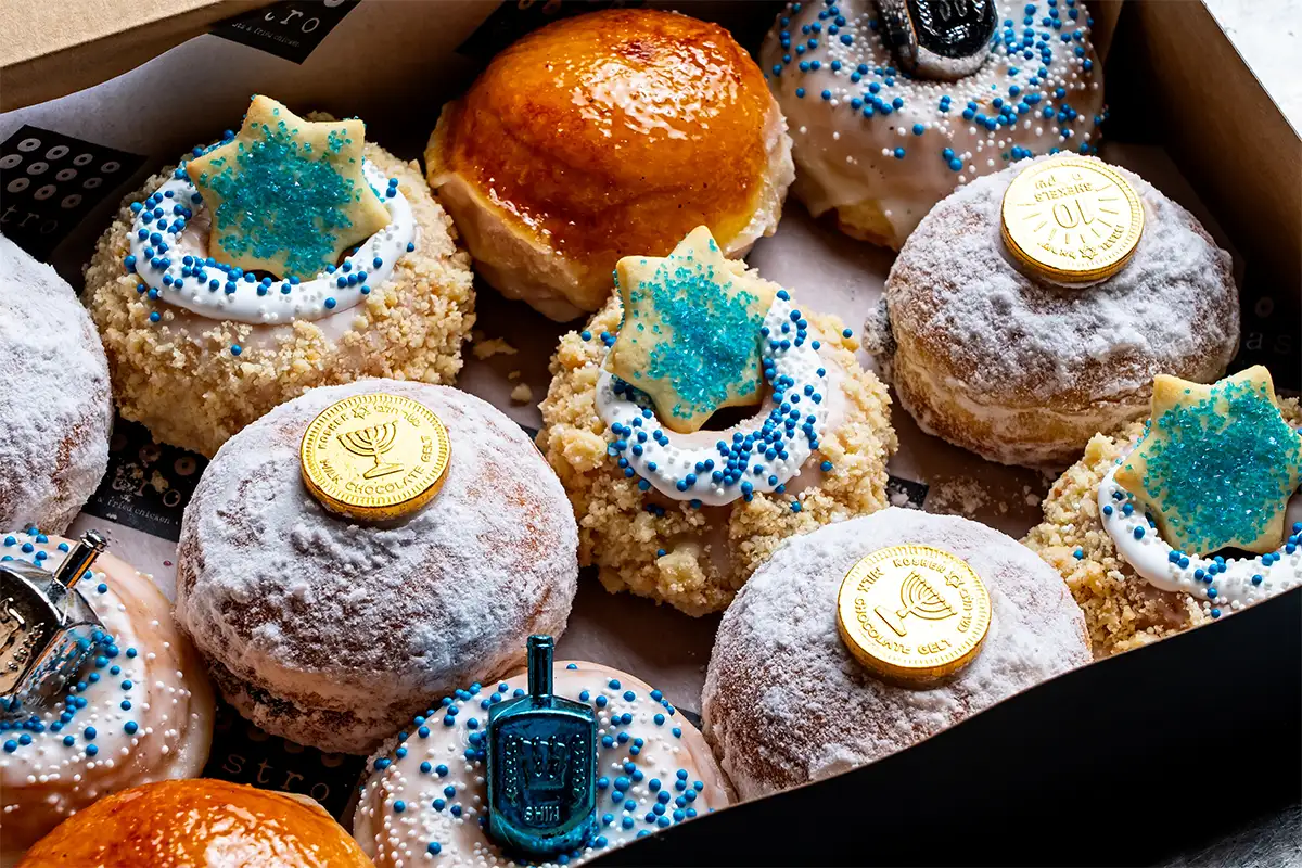 a dozen doughnuts from Astro Doughnuts & Fried Chicken in a box