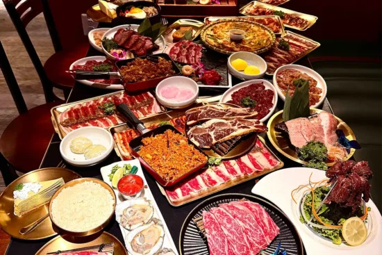 A table full of food items from Pi BBQ and Bar