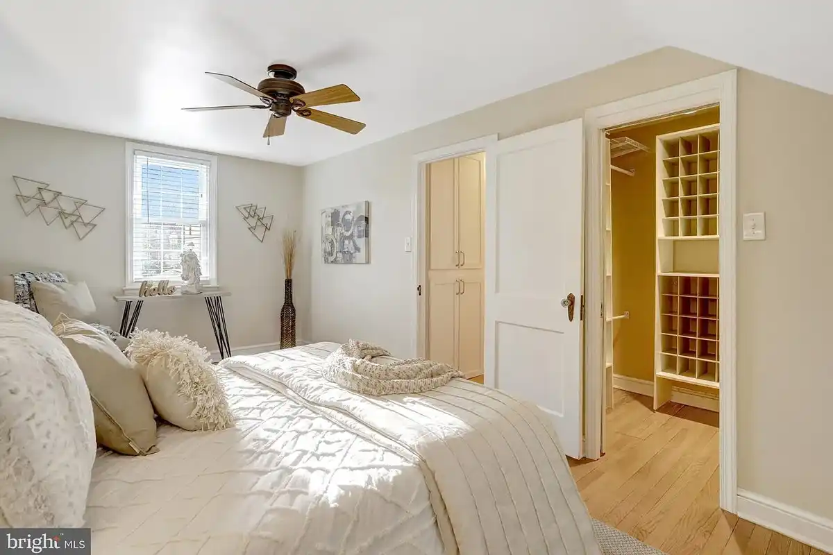 primary bedroom with walk-in closet