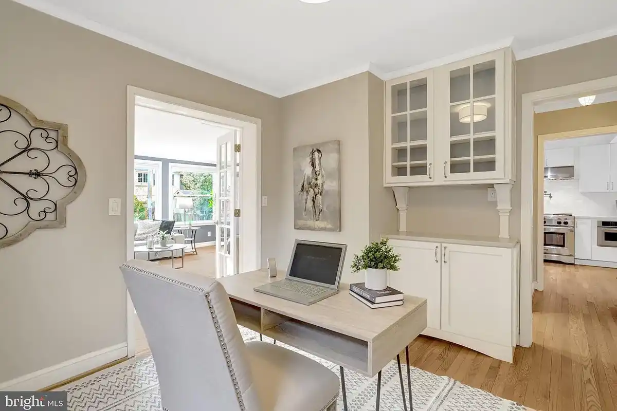 office with small desk and built-in shelves