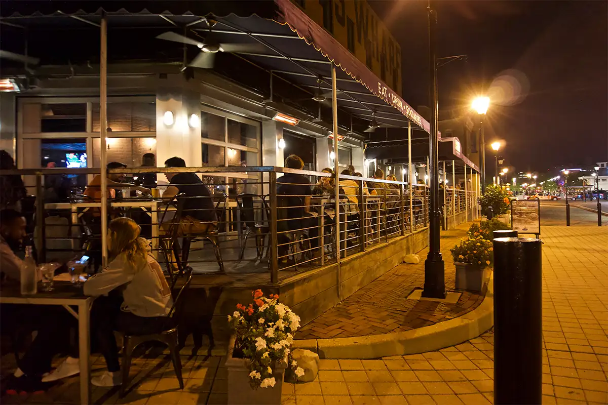 exterior shot of diners at a restaurant in Baltimore's Fells Point 