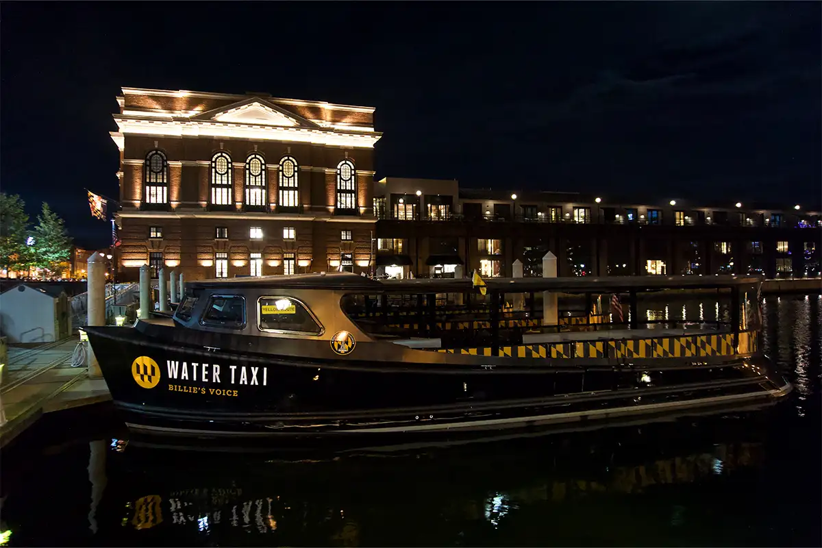  a water taxi at night in Baltimore's Fells Point