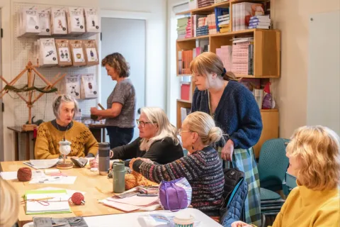 women knit in a room at Fibre Space in Alexandria