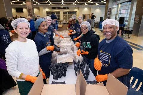 Volunteers package food during a MLK Day of Service