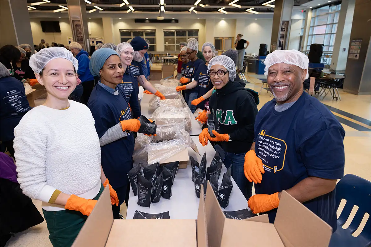 Volunteers package food during a MLK Day of Service
