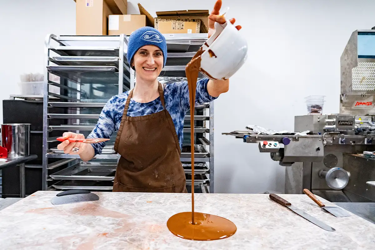Woman pouring chocolate at River-Sea chocolates