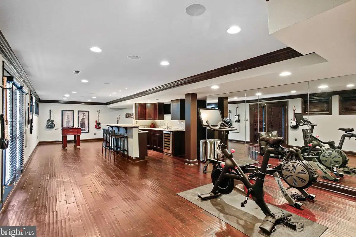 Finished basement with exercise equipment