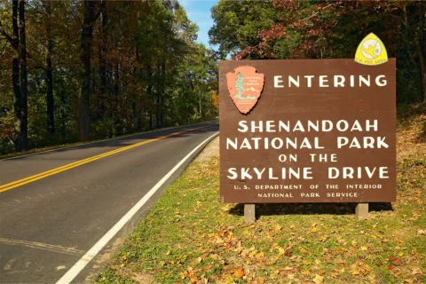 sign that says "Entering Shenandoah National Park on the Skyline Drive"