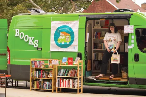 Tessa Cannon in the Wandering Shelf mobile bookstore