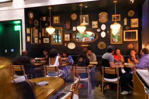 people eating inside Grazie Nonna restaurant in Old Town