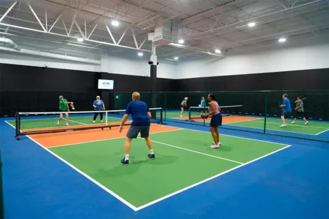 pickleball players on a court