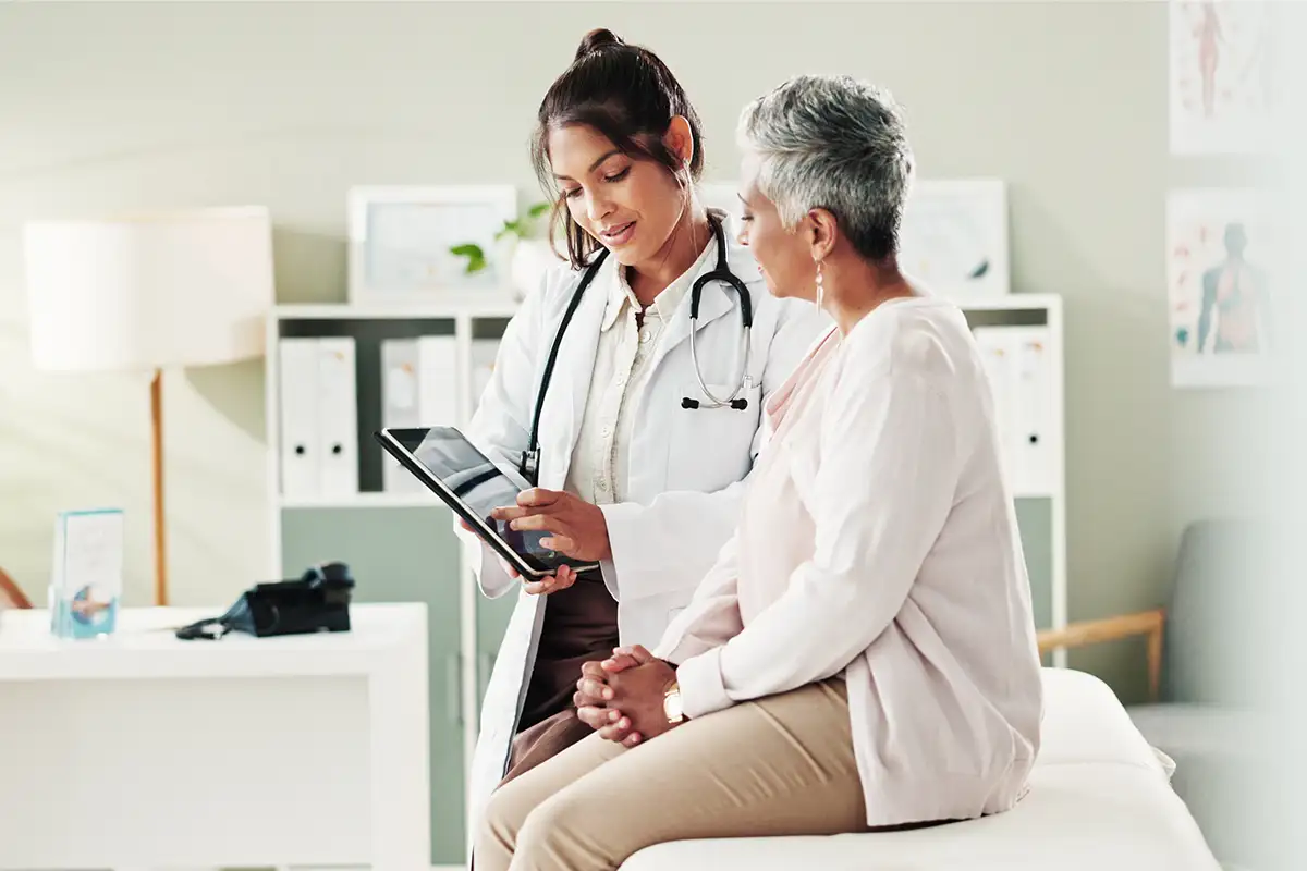 Woman talking to doctor