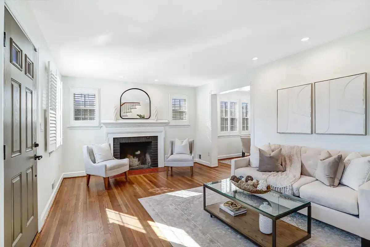 white living room with fireplace and hardwood floors