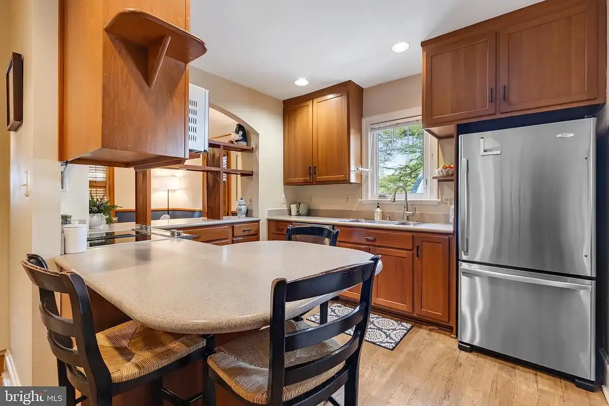 kitchen with stool seating and stainless steel appliances