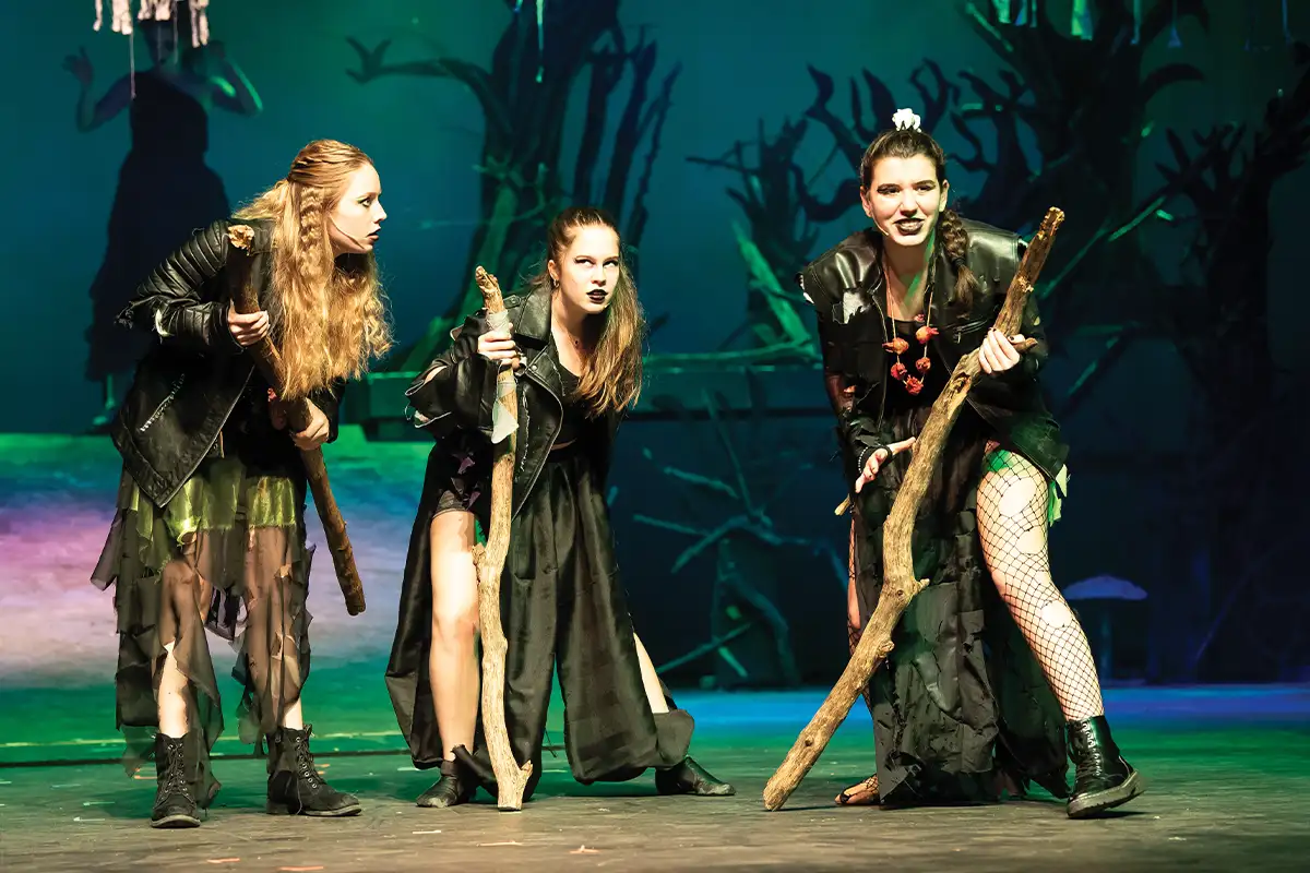 Herndon High School students Allie Blanchet, Jane Keifer, and Ace Lamoureux perform in Macbeth in 2024.