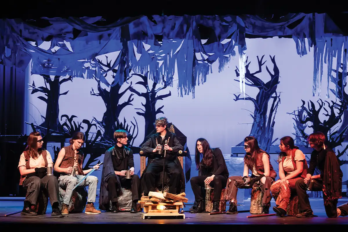 Herndon High School students Ruby Chernowetz, William Spies, Henry Waldrop, Sumner Langston, Hazel Richardson, Natalie Delpino, Allie Steinhardt, and Luca Aten perform in Macbeth